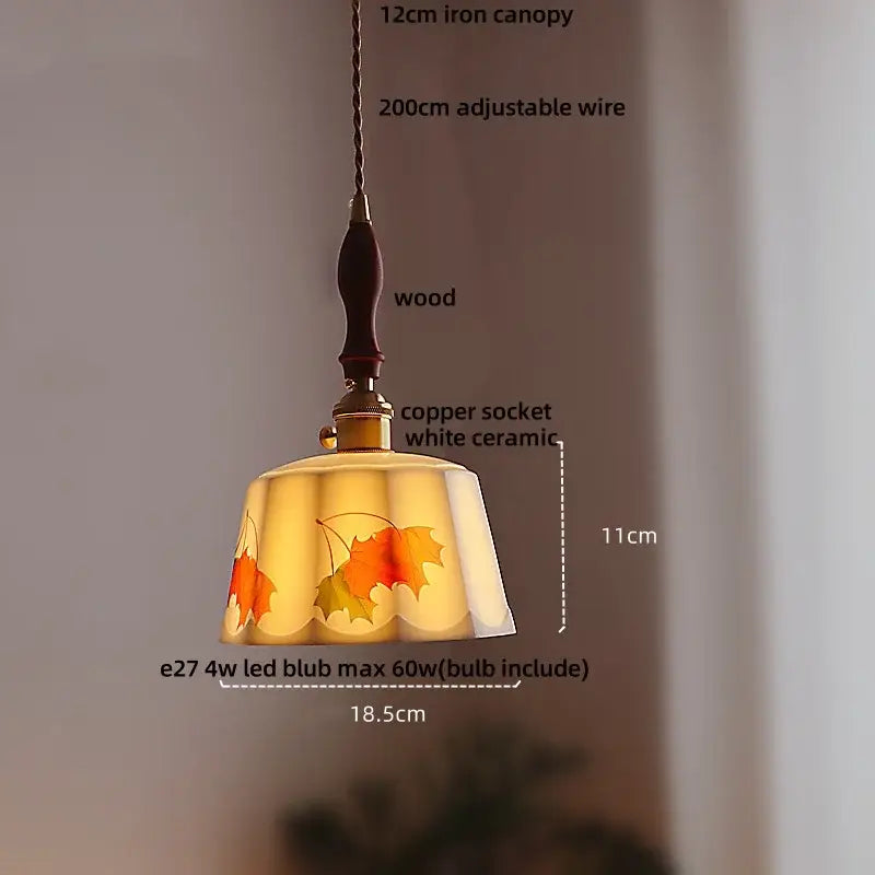 Warm-toned pendant light with autumn leaf glass shade suspended by brown wood led handle and iron canopy for dining room decorbites brown wood
