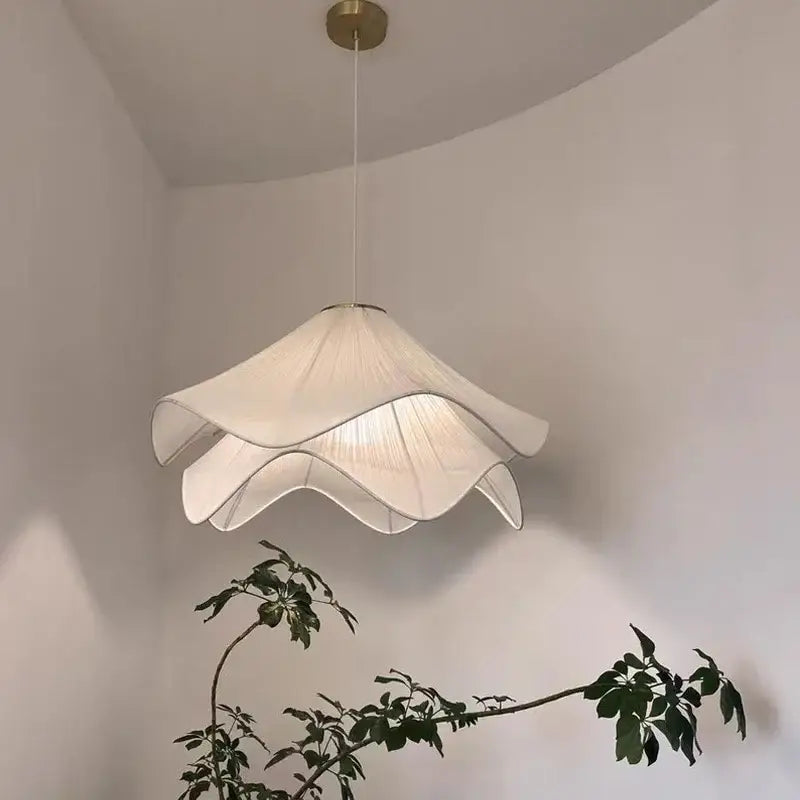 Delicate cream fabric led pendant light with layered petal design hanging from brass fixture for bedroom decorbites cream fabric