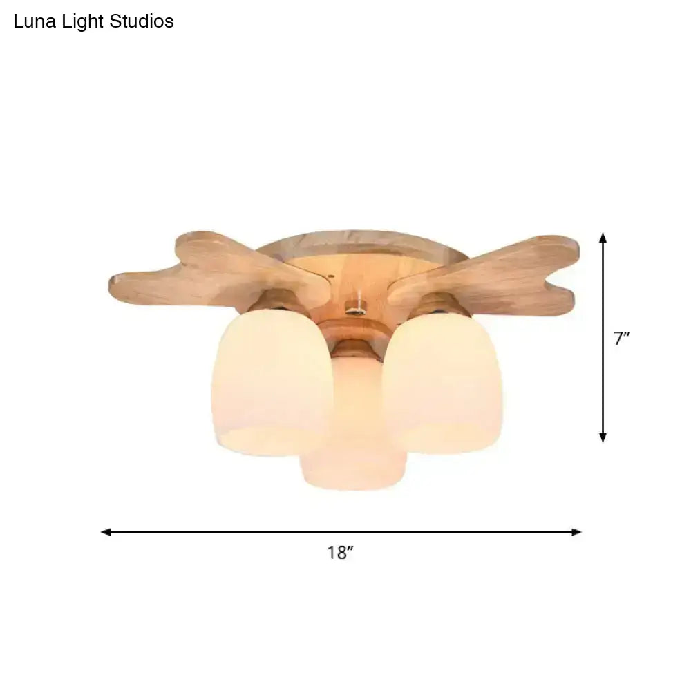 Wooden ceiling fan with three frosted cream glass bell shades in nordic style for bedroom lighting