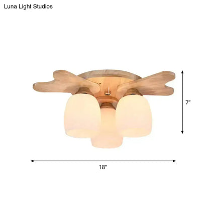 Wooden ceiling fan with three frosted cream glass bell shades in nordic style for bedroom lighting