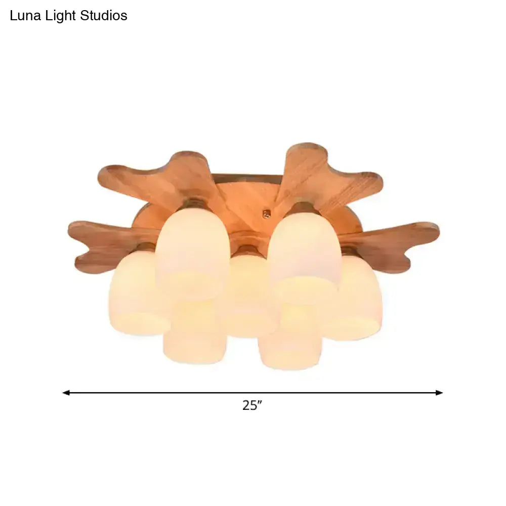 Nordic cream glass bell ceiling light with warm-toned wooden fixture and five frosted cream glass shades for bedroom