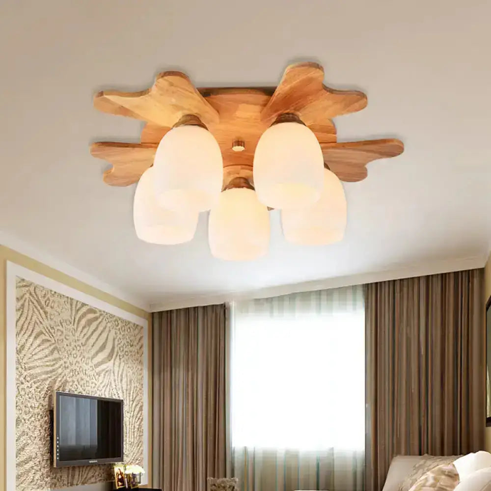 Nordic cream glass bell ceiling light with warm-toned wood antler and five frosted cream glass shades for bedroom
