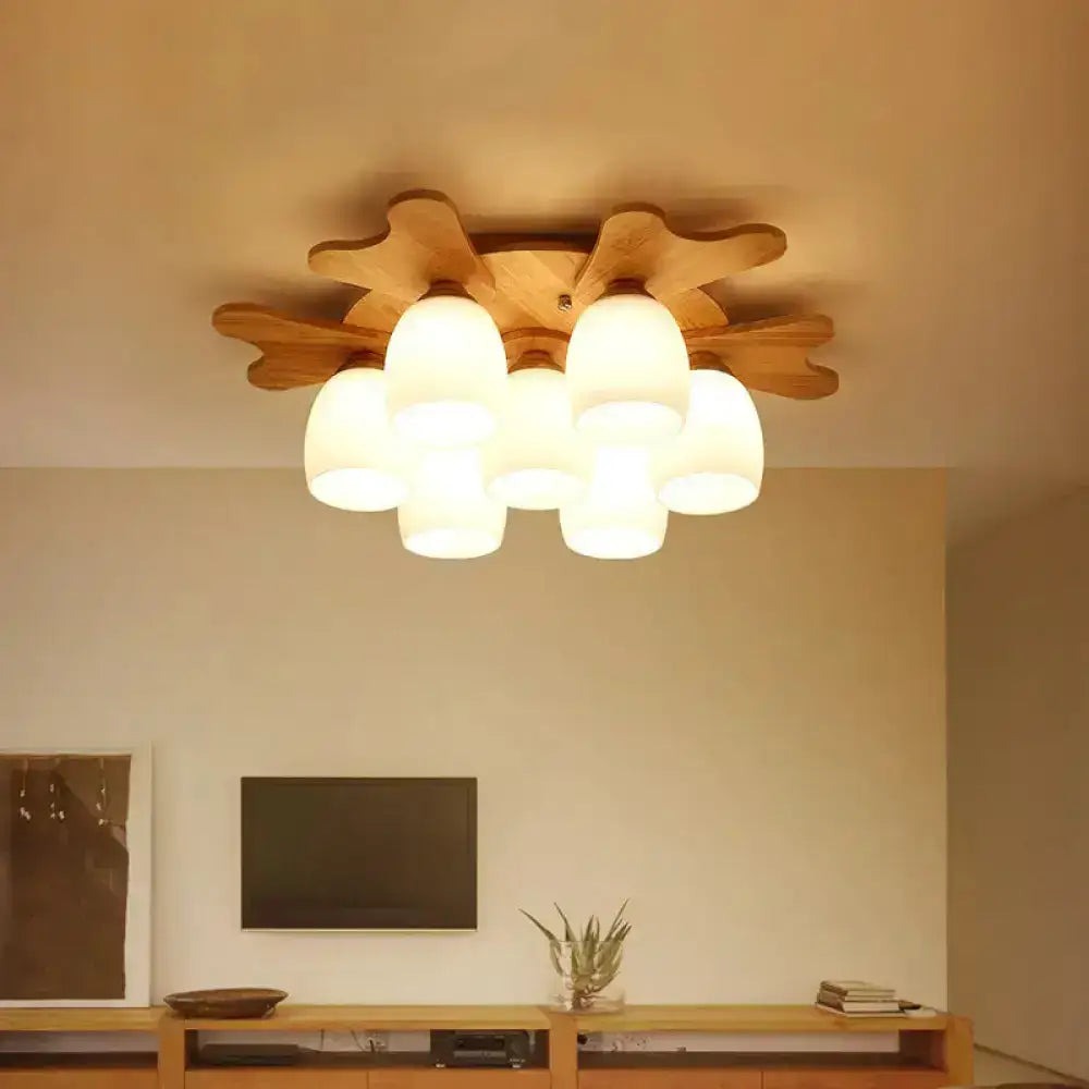 Nordic cream glass bell ceiling light with warm-toned wood antler and six frosted glass shades for bedroom