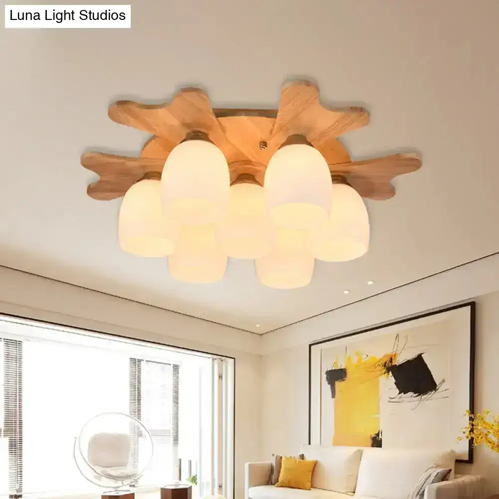 Nordic cream glass bell ceiling light with warm-toned cloud-shaped frosted shades and natural wood base for bedroom