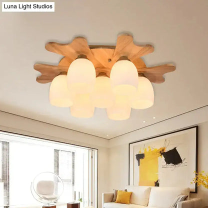 Nordic cream glass bell ceiling light with wooden antler and five frosted cream glass shades in natural wood finish