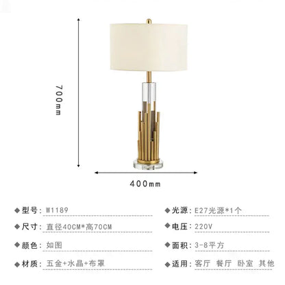 Elegant nordic crystal table lamp with gold-toned brass accents and off-white fabric shade for bedroom use