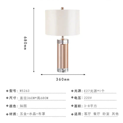 A sleek 680mm tall nordic crystal table lamp with rose gold metallic base brass accents and ivory fabric shade