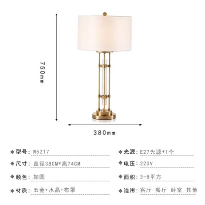 Nordic crystal table lamp with gold metal frame, vertical crystal accents, and cream fabric shade for bedroom use