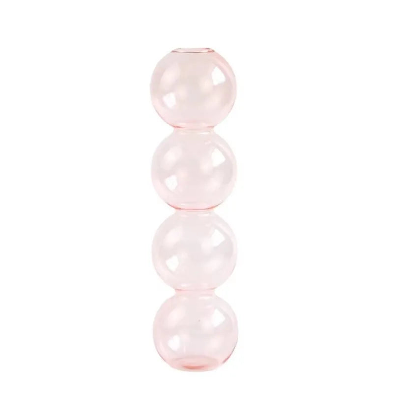 A translucent pink nordic glass bubble vase with four stacked spheres for home desk decor and flower arrangement