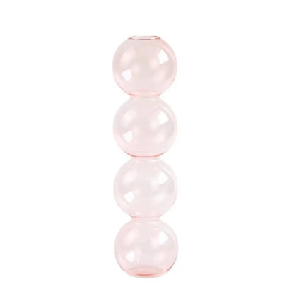 A translucent pink nordic glass bubble vase with four stacked spheres for home desk decor and flower arrangement