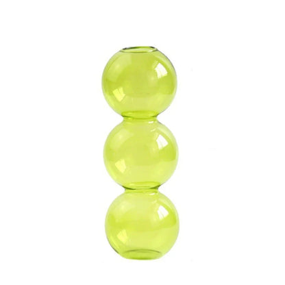 A translucent lime green nordic glass bubble vase made of three stacked spherical segments for hydroponic decor