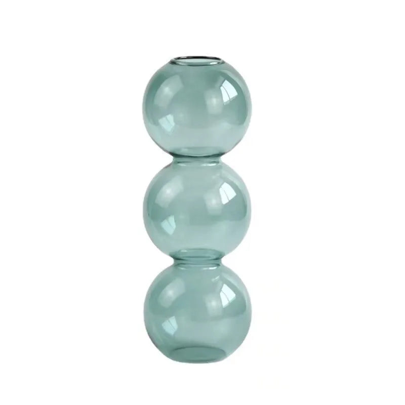 A sleek translucent teal nordic glass bubble vase with three stacked spheres for hydroponic planting and decor