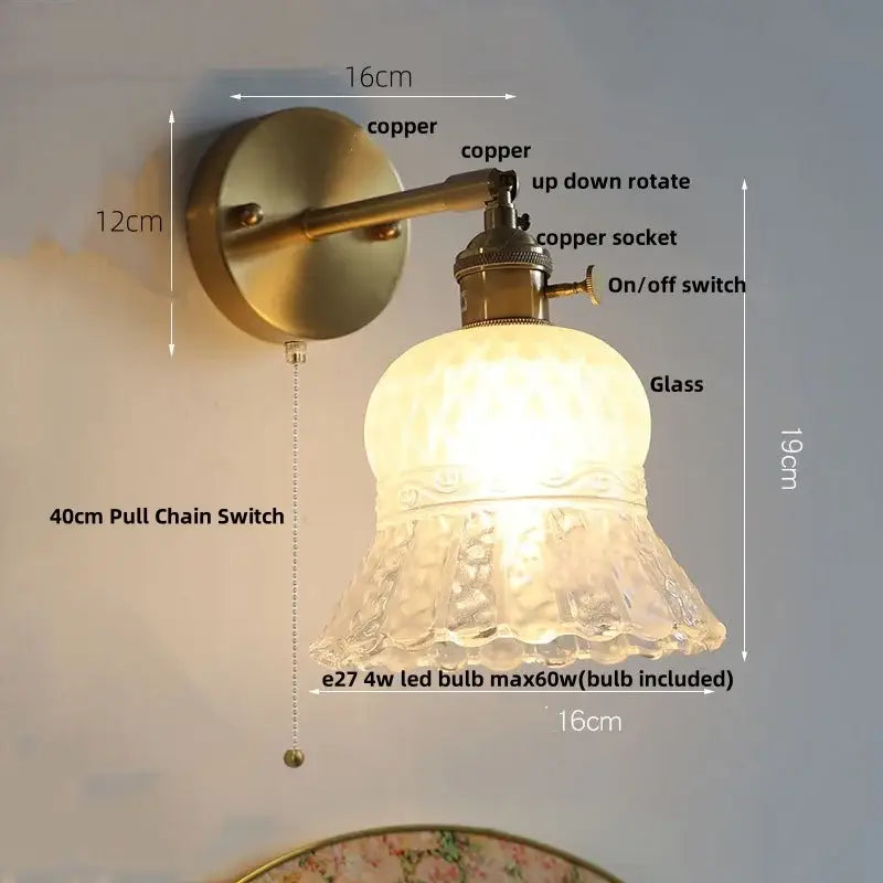 Antique brass-finished nordic gold brass led wall sconce with textured frosted glass shade and adjustable arm for bedroom decor