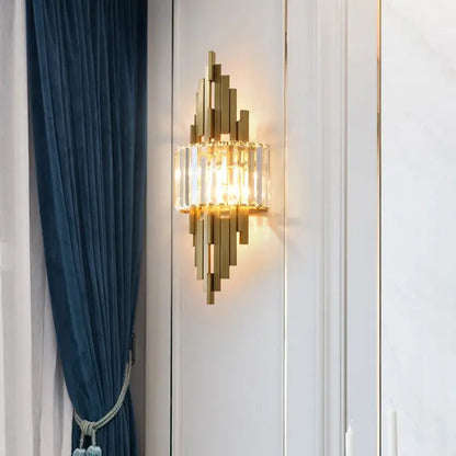 Gold-toned nordic crystal wall sconce with vertical crystal bars and central glass panel for living room decorbites crystal wall