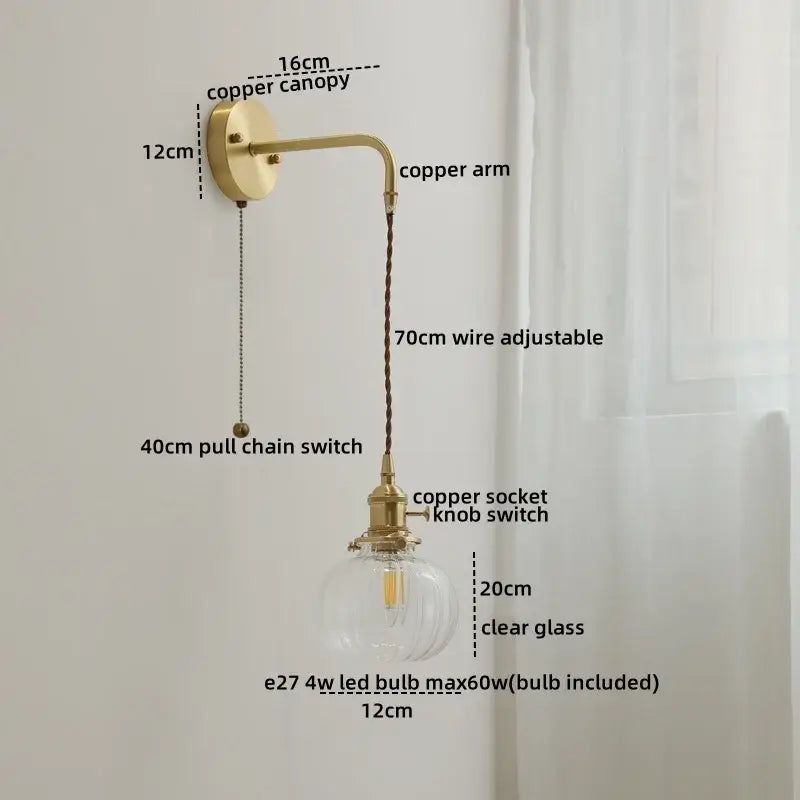 A vintage-style copper wall sconce lamp with clear glass bulb holder and adjustable wire for bedroom use