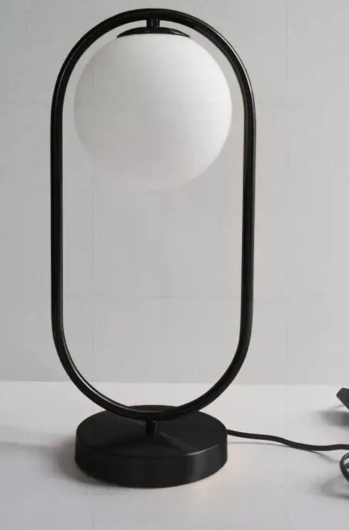 Black metal frame table lamp with frosted white glass ball shade featuring decorbites glass ball led design for bedroom decor