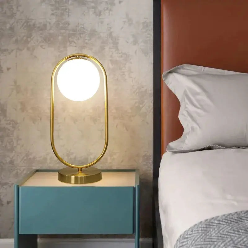 Nordic gold oval glass ball led desk lamp with gold-toned oval frame and glowing bulb for bedroom decorbites glass ball decor