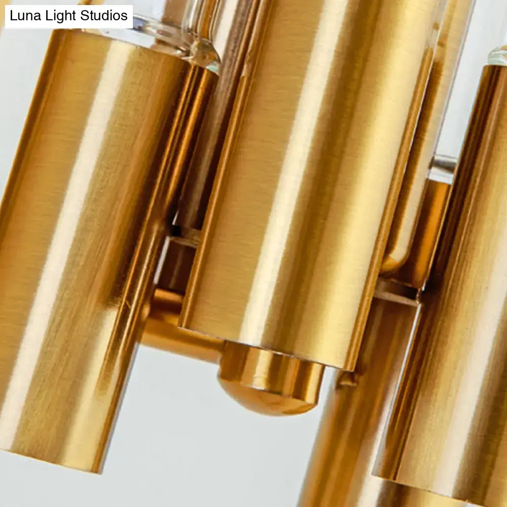 Nordic gold tube wall lamp with golden brass cylindrical elements and polished reflective surfaces for living room