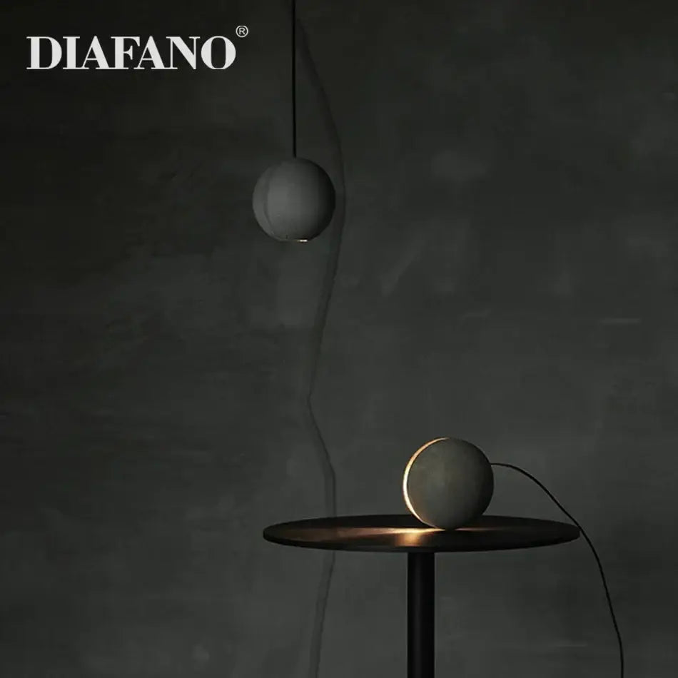 Diafano matte gray cement pendant light and table lamps with a spherical shape for nordic dining room decorbites cement pendant