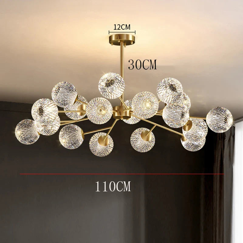 Gold-toned nordic dining room pendant lamp with clear textured glass spheres and brass fixture for indoor ceiling lighting