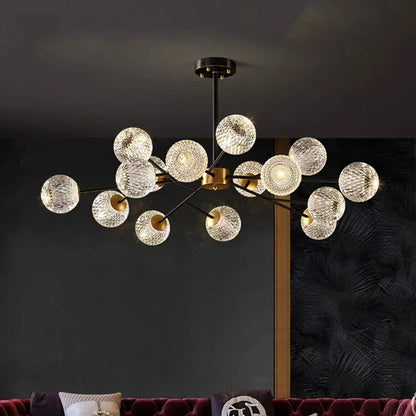 Modern chandelier with clear textured glass spheres on black and gold metal frame for Nordic dining room lighting