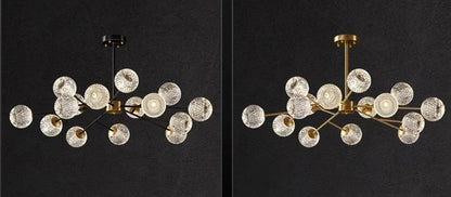 Modern chandelier with clear textured glass globe shades and black or gold metallic frame for nordic dining room lighting