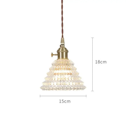 A nordic japan style glass pendant light with tiered crystal design, brass base, and twisted brown cord, 18cm height