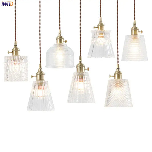 Nordic Japan style glass pendant lights with clear textured faceted shades and brass fixtures for dining room lighting