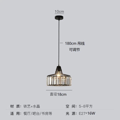 A modern black iron pendant lamp with clear crystal prisms and adjustable cord for dining or bar areas