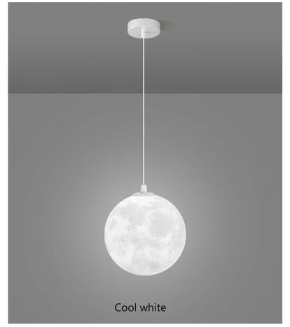 A spherical cool white nordic LED moon pendant light with textured crater surface for dining room kitchen decor