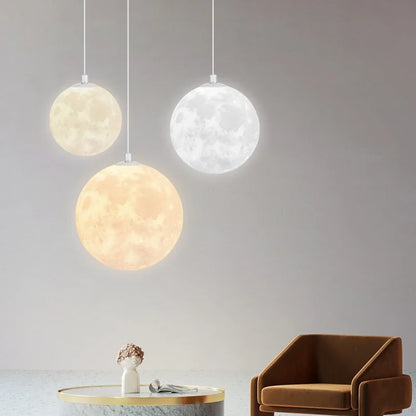 Nordic led moon pendant chandeliers with textured crater surface emitting warm and cool light for dining room kitchen decor
