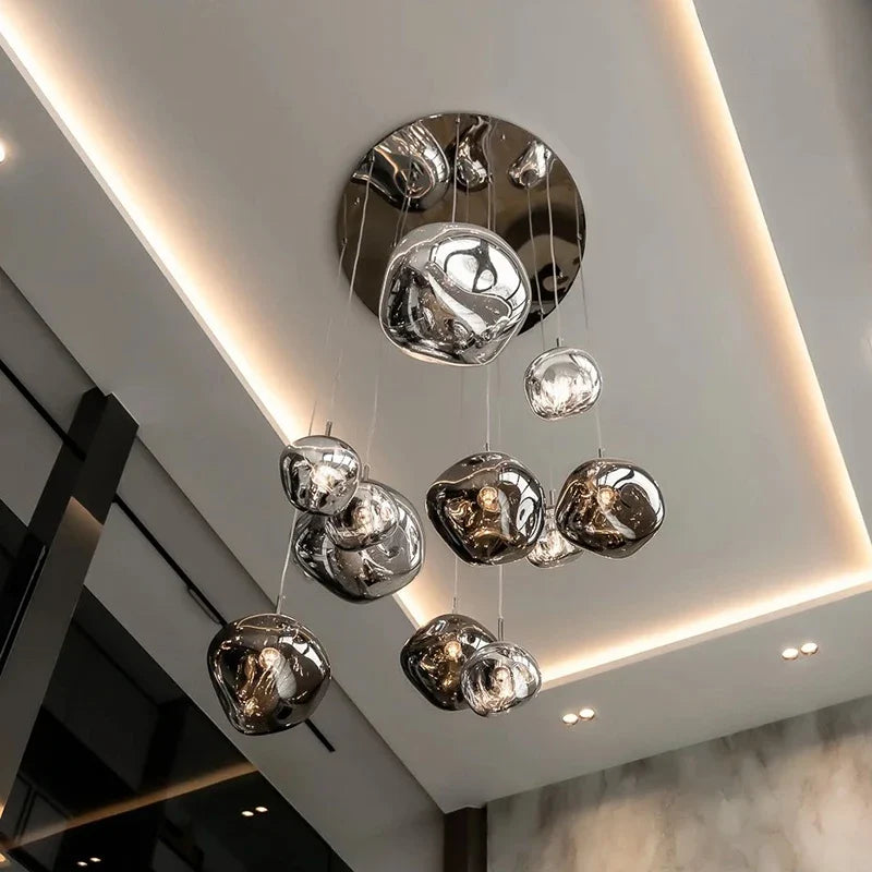 Modern chrome-finished glass globe pendant light with minimalist design for bedroom and living room indoor lighting