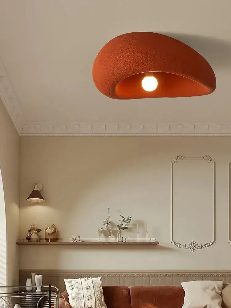 A warm orange textured ceiling light with smooth curved design for bedroom nordic ceiling light fixture
