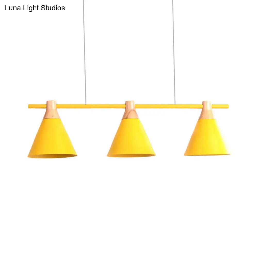 Bright yellow conical metal pendant lights with wooden accents hanging from a bar in DecorBites Nordic chandelier