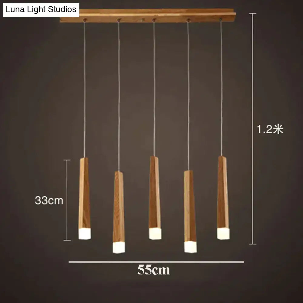 Modern nordic minimalist wood pendant lamp with five tapered wood rods and white acrylic ends for dining room