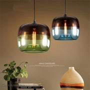 Two nordic modern apple pendant lights with gradient modern apple glass in dark amber green and blue clear tones for home decor