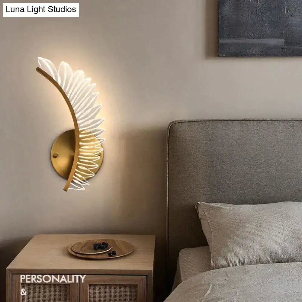 Gold-toned feather wall lamp in nordic modern art style with elegant design for modern art bedside use