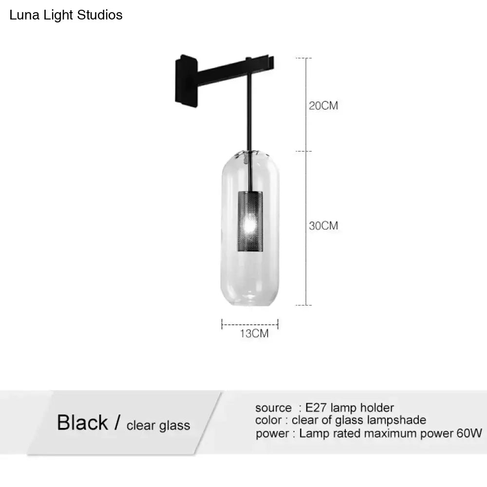 Black metal wall sconce with clear glass lampshade in nordic modern decor brass and glass wall lamp for bedroom