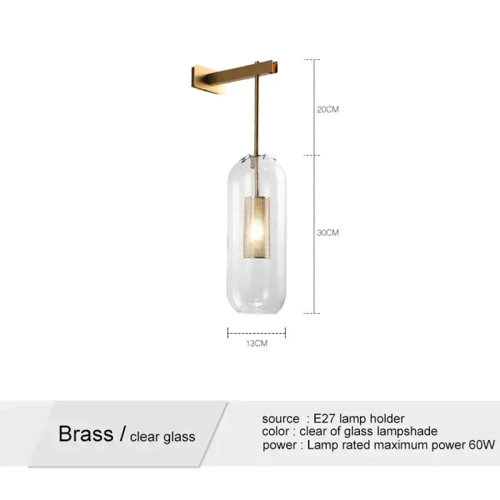 A nordic modern decor brass wall lamp with a clear glass lampshade and e27 bulb holder for bedroom use