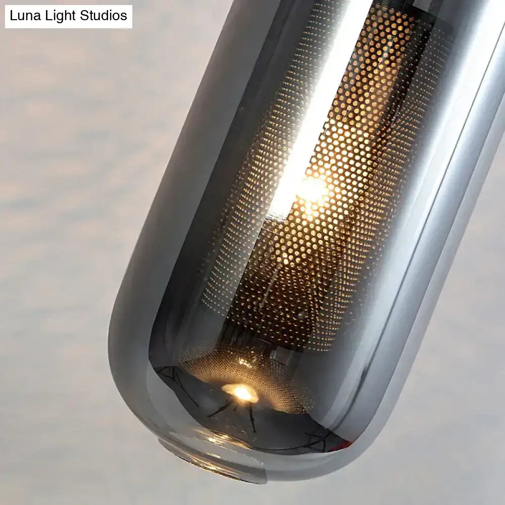 A nordic modern decor brass and glass wall lamp featuring a sleek glass lampshade with honeycomb mesh design