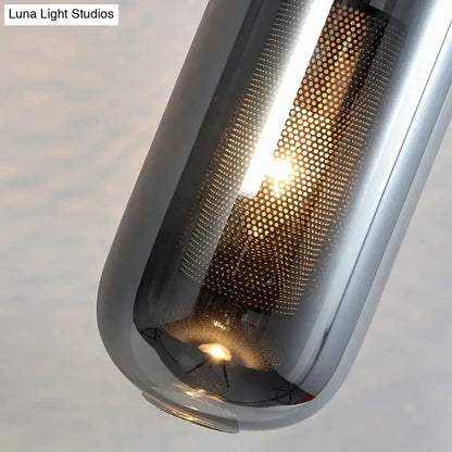 A nordic modern decor brass and glass wall lamp featuring a sleek glass lampshade with honeycomb mesh design
