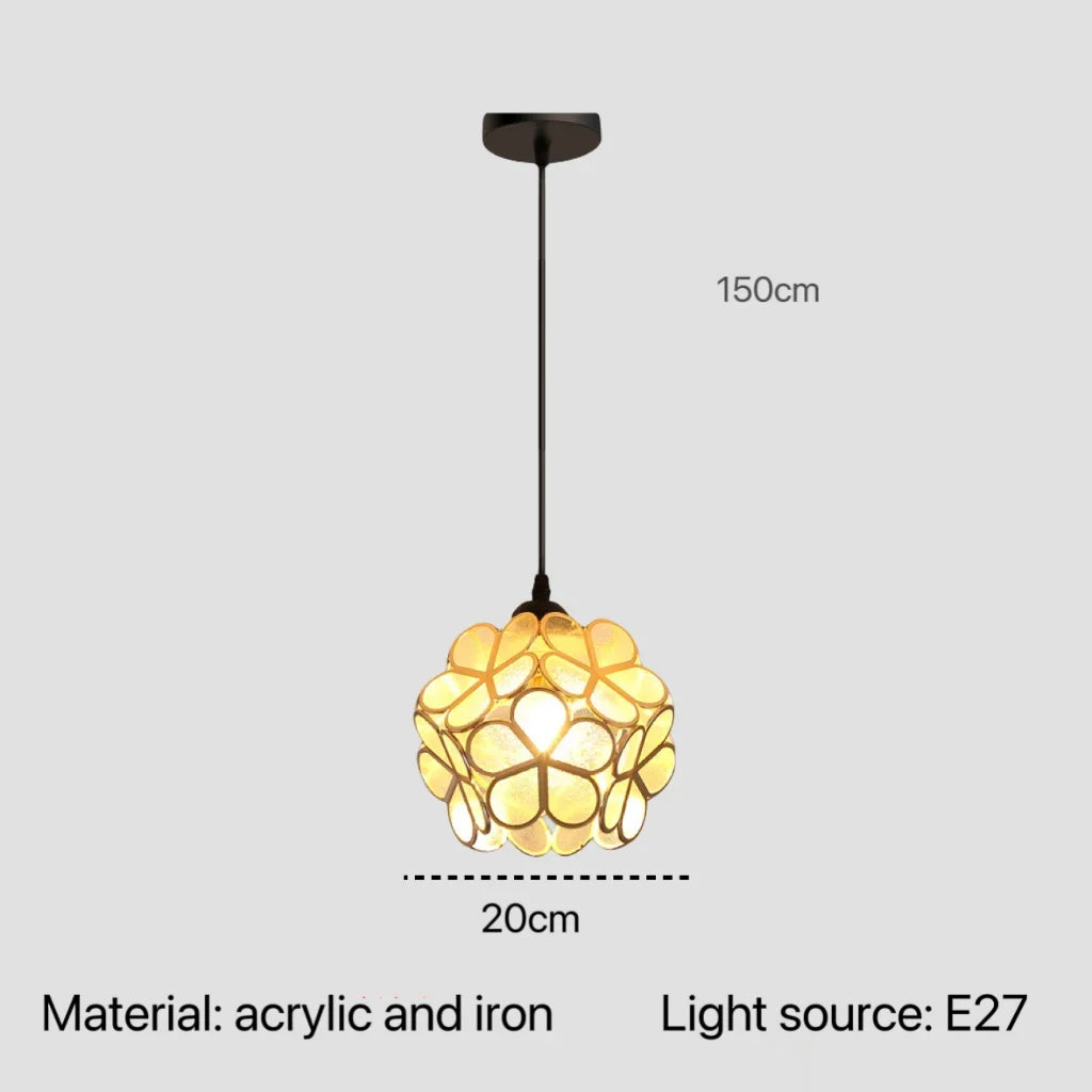 A warm glowing nordic modern pendant lamp with yellow translucent acrylic petals and an iron frame for bedroom lighting