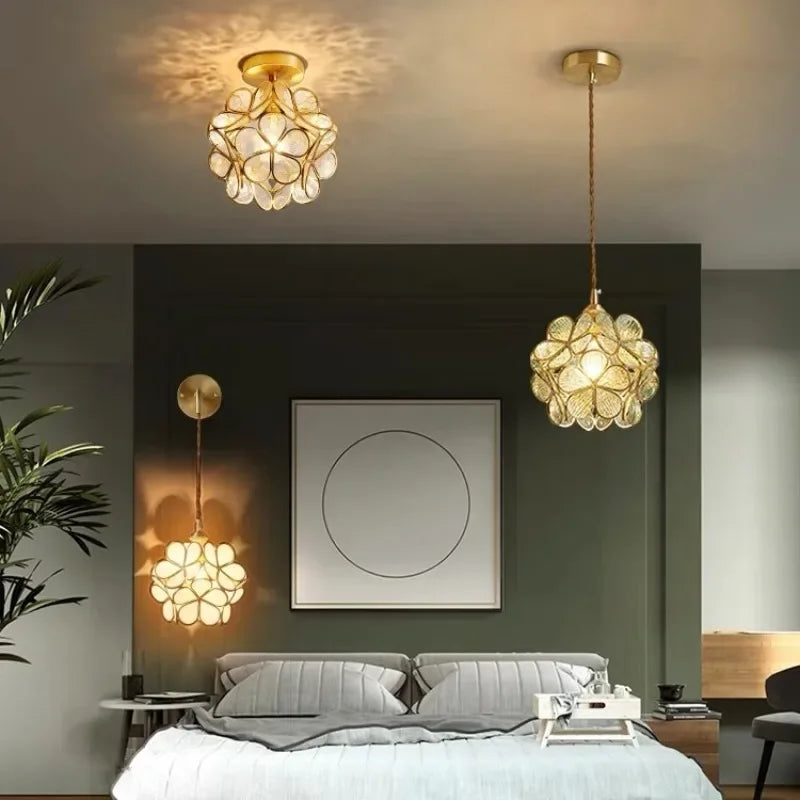 Gold-toned nordic modern flower-shaped pendant lamp with clear acrylic petals for bedroom and restaurant lighting