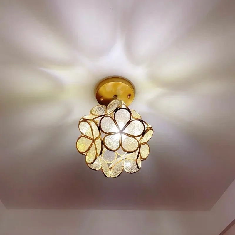 Gold-toned nordic modern petal pendant lamp with translucent textured glass petals for bedroom and restaurant lighting