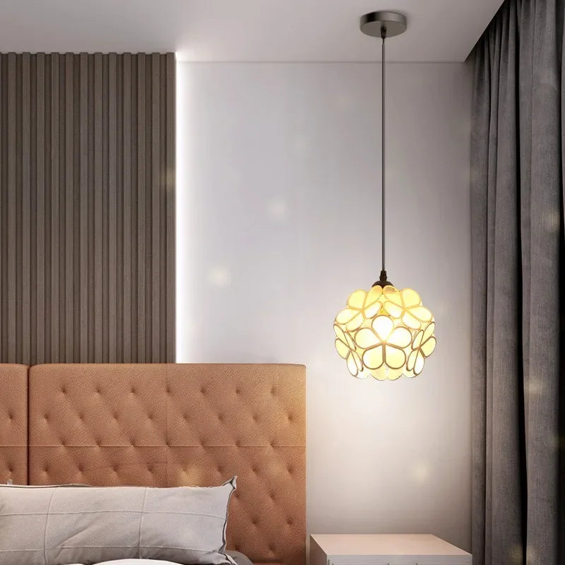 A warm glowing nordic modern petal acrylic pendant lamp with yellow floral translucent glass for bedroom or restaurant lighting