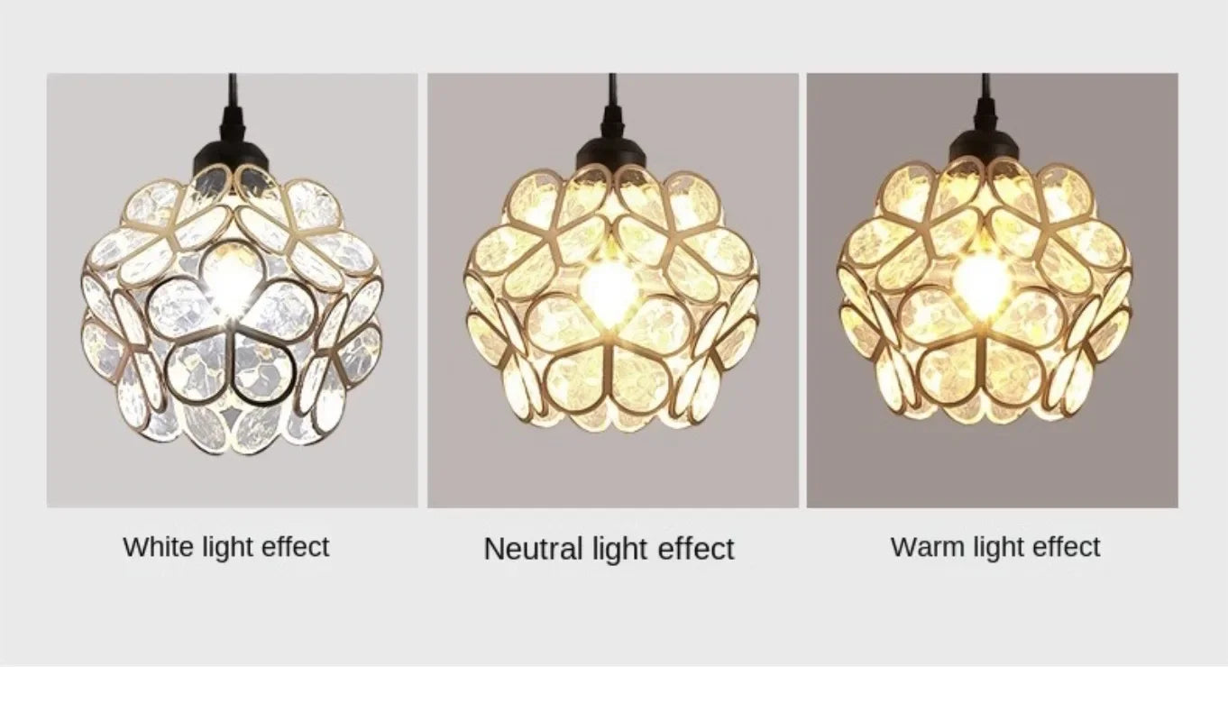 Nordic modern spherical pendant lamp with black metal frame and clear faceted glass petals for bedroom or restaurant lighting