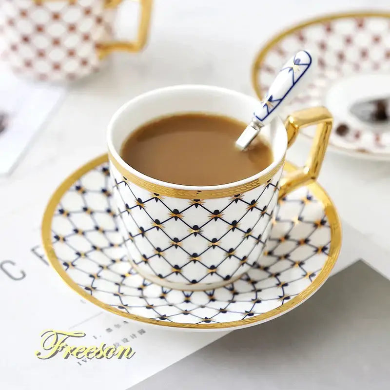 White porcelain bone china coffee set with gold trim black geometric pattern and matching saucer for dining room use
