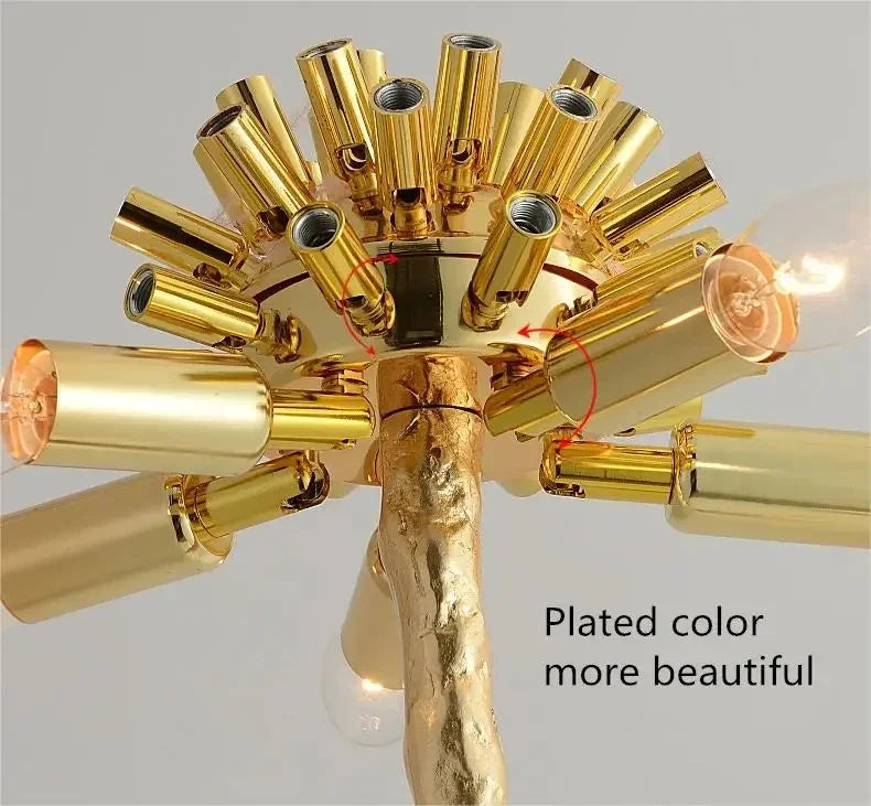 Golden-plated floor lamp with a textured branch-like stem and multiple cylindrical arms for living room decor