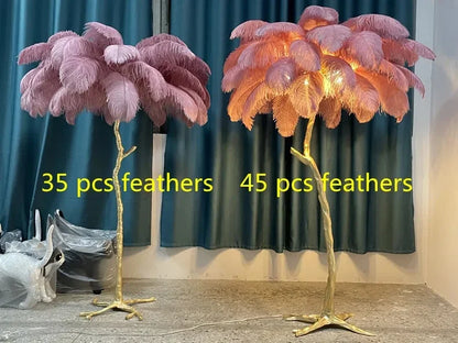 Two ornate nordic feather floor lamps with golden bases featuring pink and peach ostrich feathers for living room decor