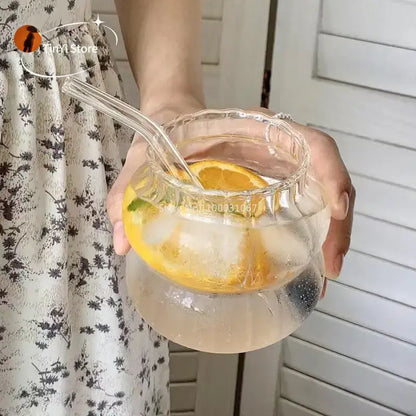 Clear glass pitcher with scalloped rim and handles filled with ice water and lemon slices for glass cocktail cups set decorbites